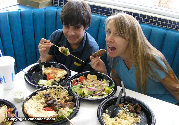 Kelly and Ben eating Big Greek food on the way to California