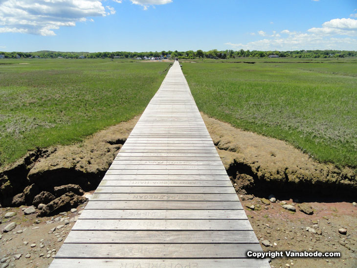 light grey hand built pier without railing in Boardwalk Beach Sandwich Massachusetts