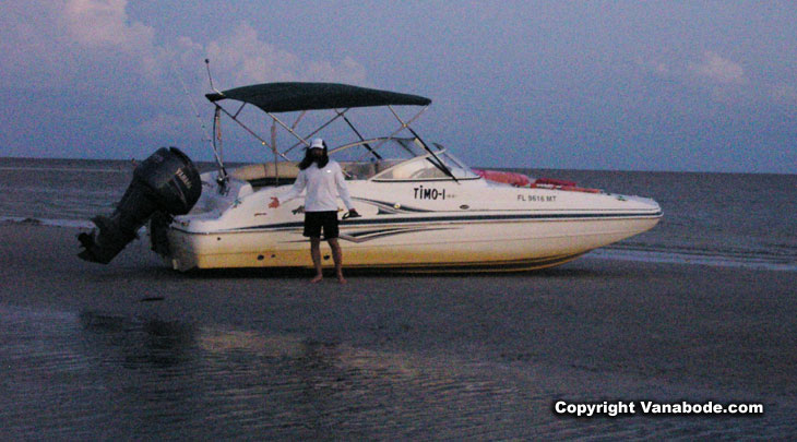 picture of beached boat during low tide on fort myers beach