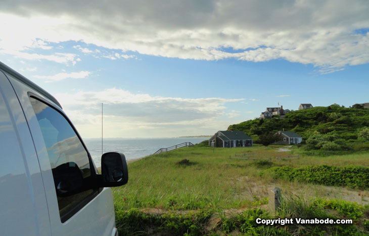 on teh grassy knoll above sandy beach in massachusetts