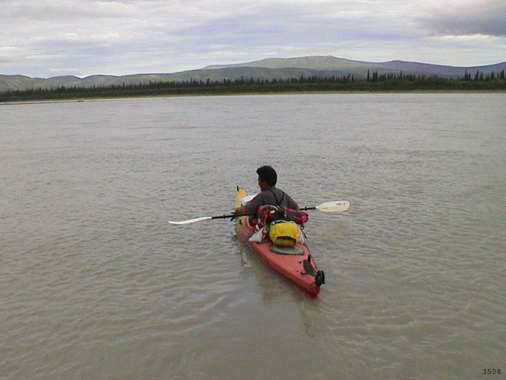 picture of kayaker floating on Charley River National Preserve Alaska