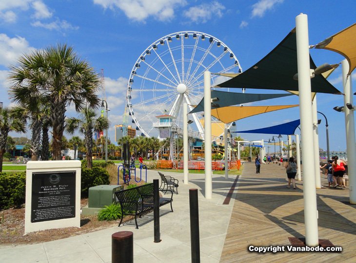 Myrtle Beach ferris wheel oceanfront on beach and boardwalk during summer