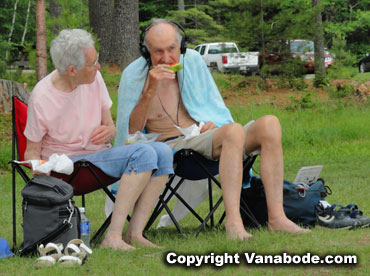 old man chomps on watermellon